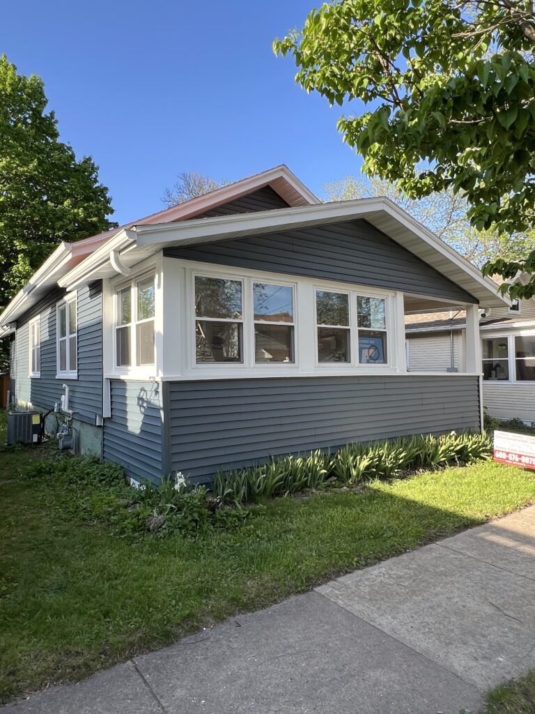 Street view of siding and windows on a house