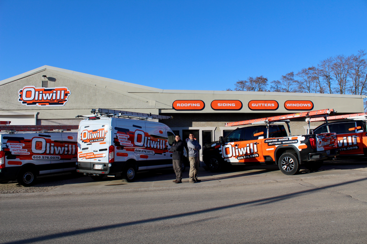 Oliwill Construction team members and service vehicles outside the company’s main office